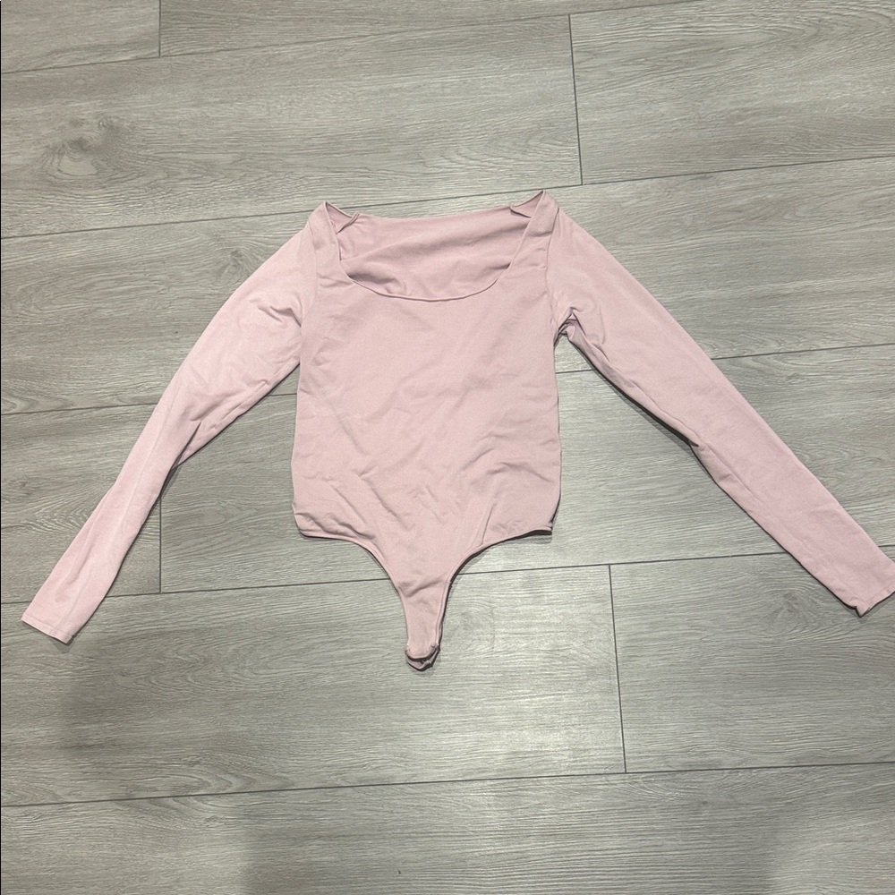 SKIMS Long Sleeve Scoop Neck Bodysuit in Light Pink